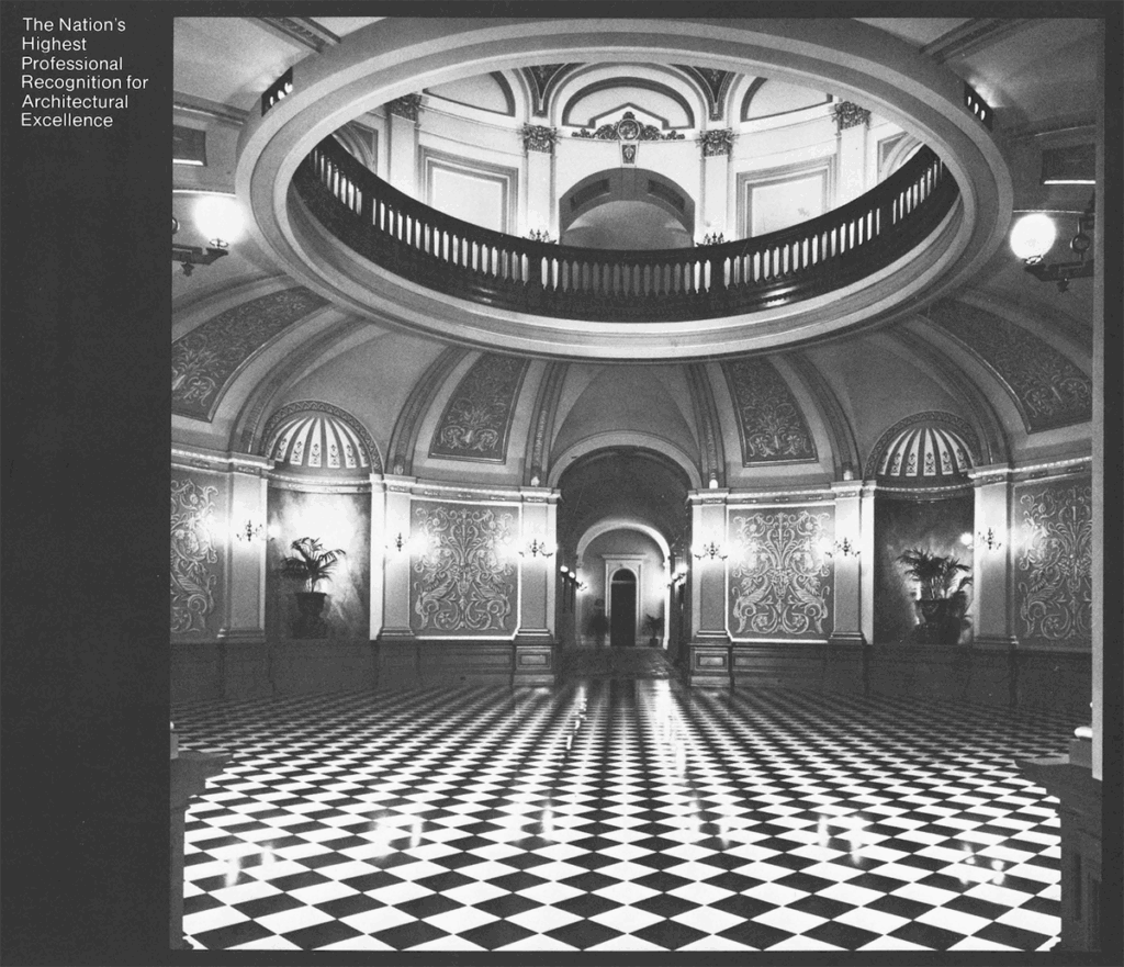 Black-and-white image of a grand classical interior featured in the 1984 AIA Honor Awards brochure, symbolizing architectural achievement.