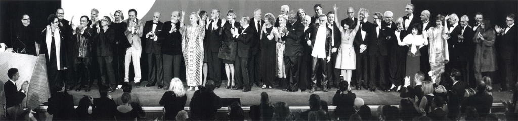 Black-and-white panorama of Rand Elliott and leading architects and designers on stage at Interior Design Magazine’s 40-Year Celebration in New York City.